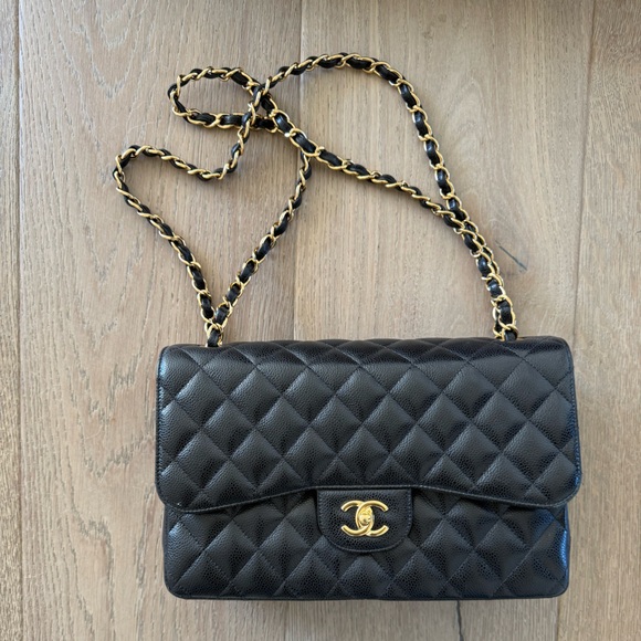 CHANEL Handbags - Chanel black Jumbo Classic Caviar Double Flap Quilted Leather Chain Bag